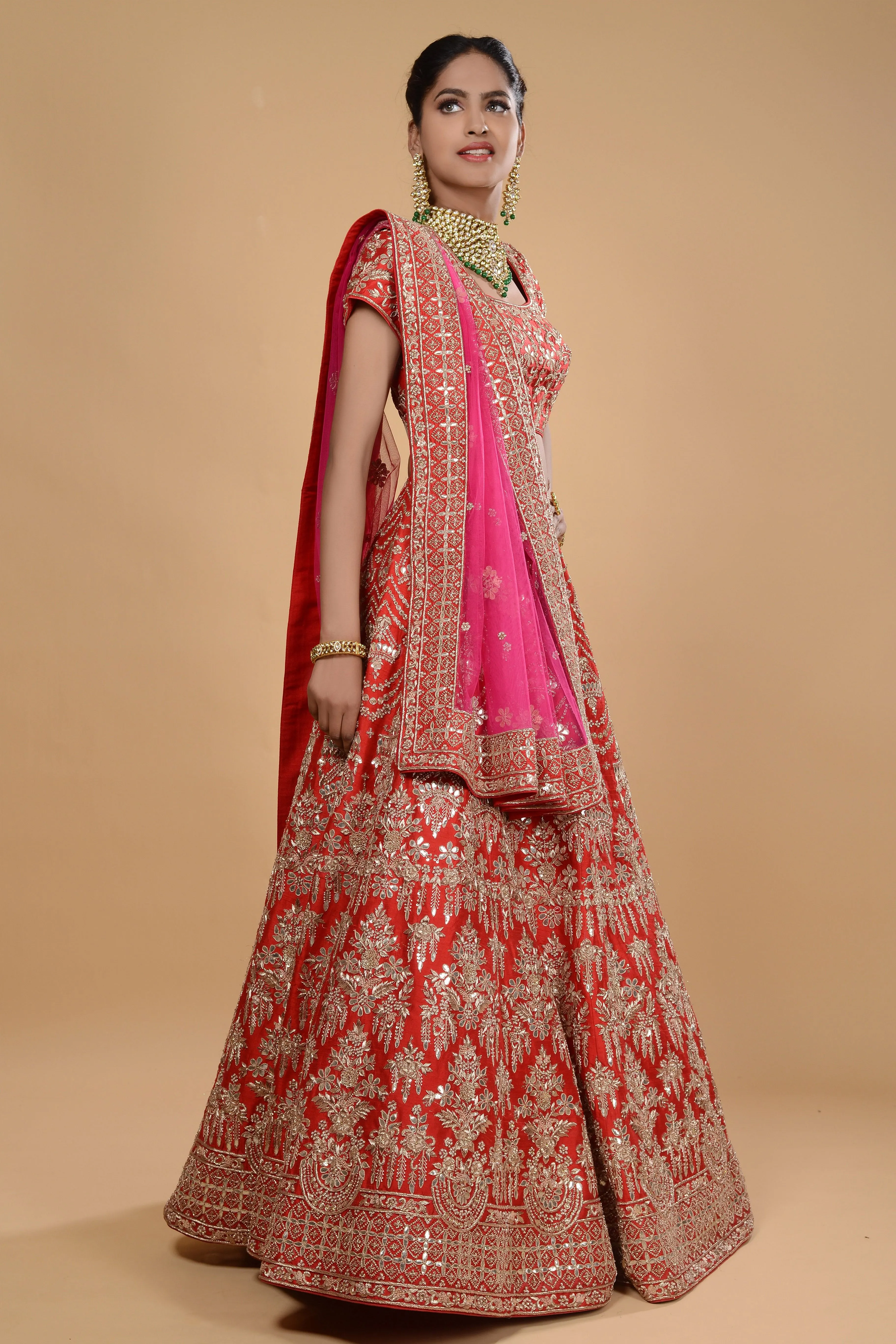 Red lehenga with pink dupatta set.