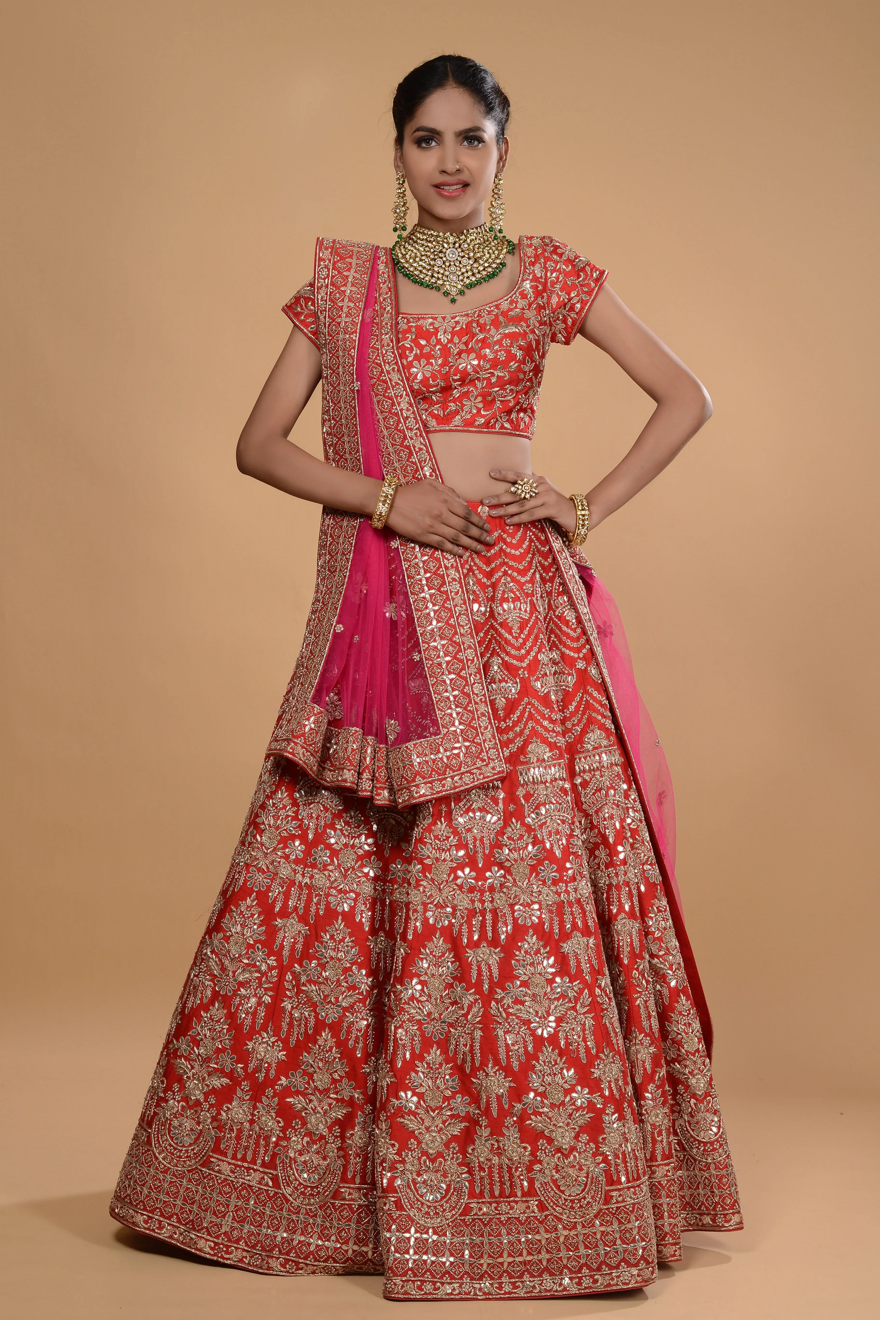 Red lehenga with pink dupatta set.