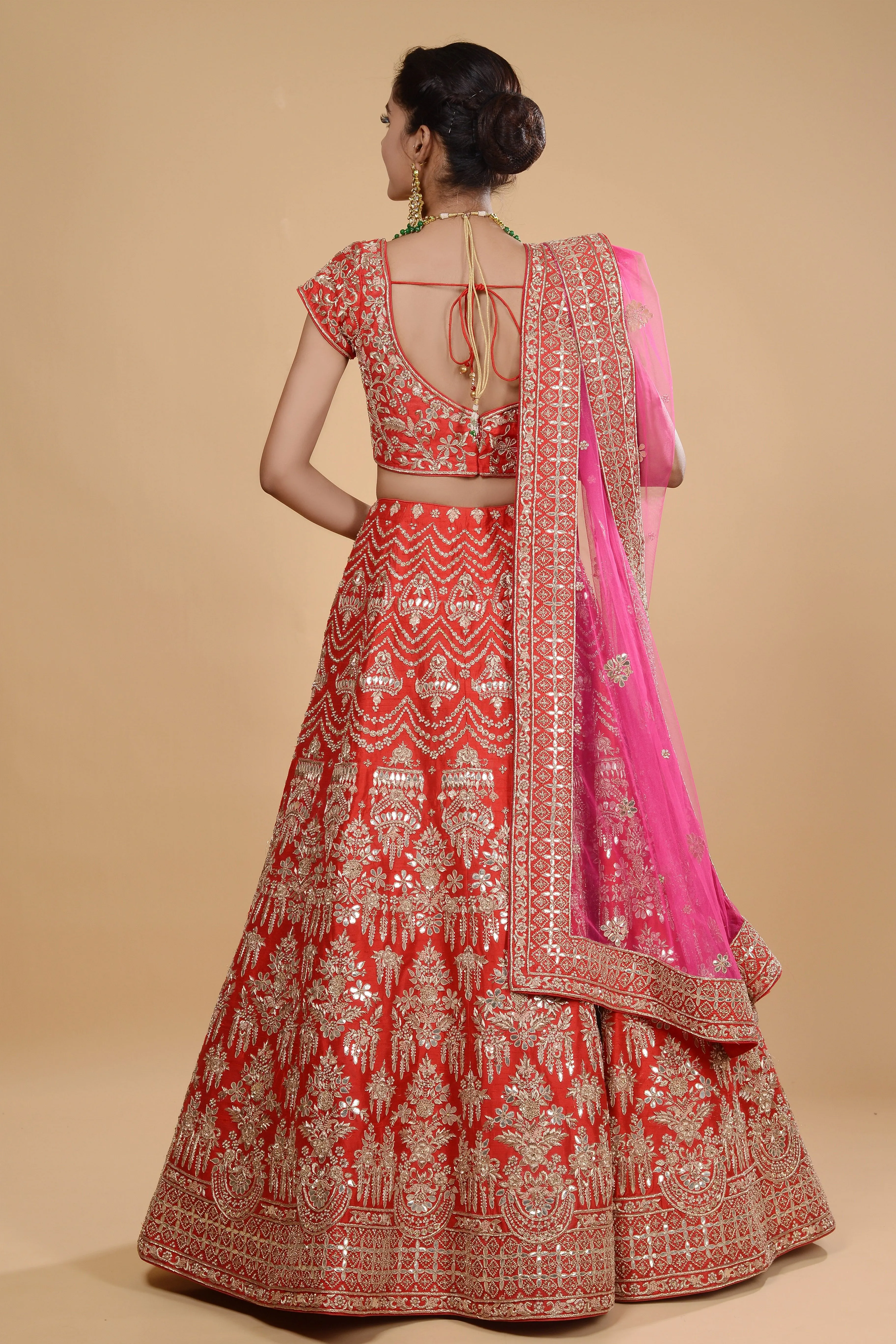 Red lehenga with pink dupatta set.